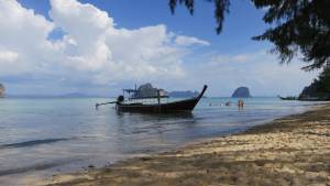 Longtail moored up at Ko Hai with Ko Wean and Ko Mook on the horizon