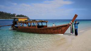 Captain 'Lek' by his boat in Ko Rok